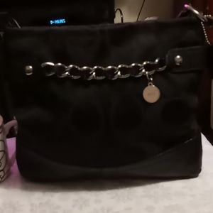 Cloth and Leather with chain and ajustable straps.